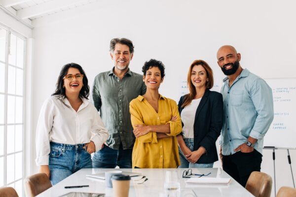 Successful,Business,Team,Standing,Together,In,A,Boardroom.,Group,Of